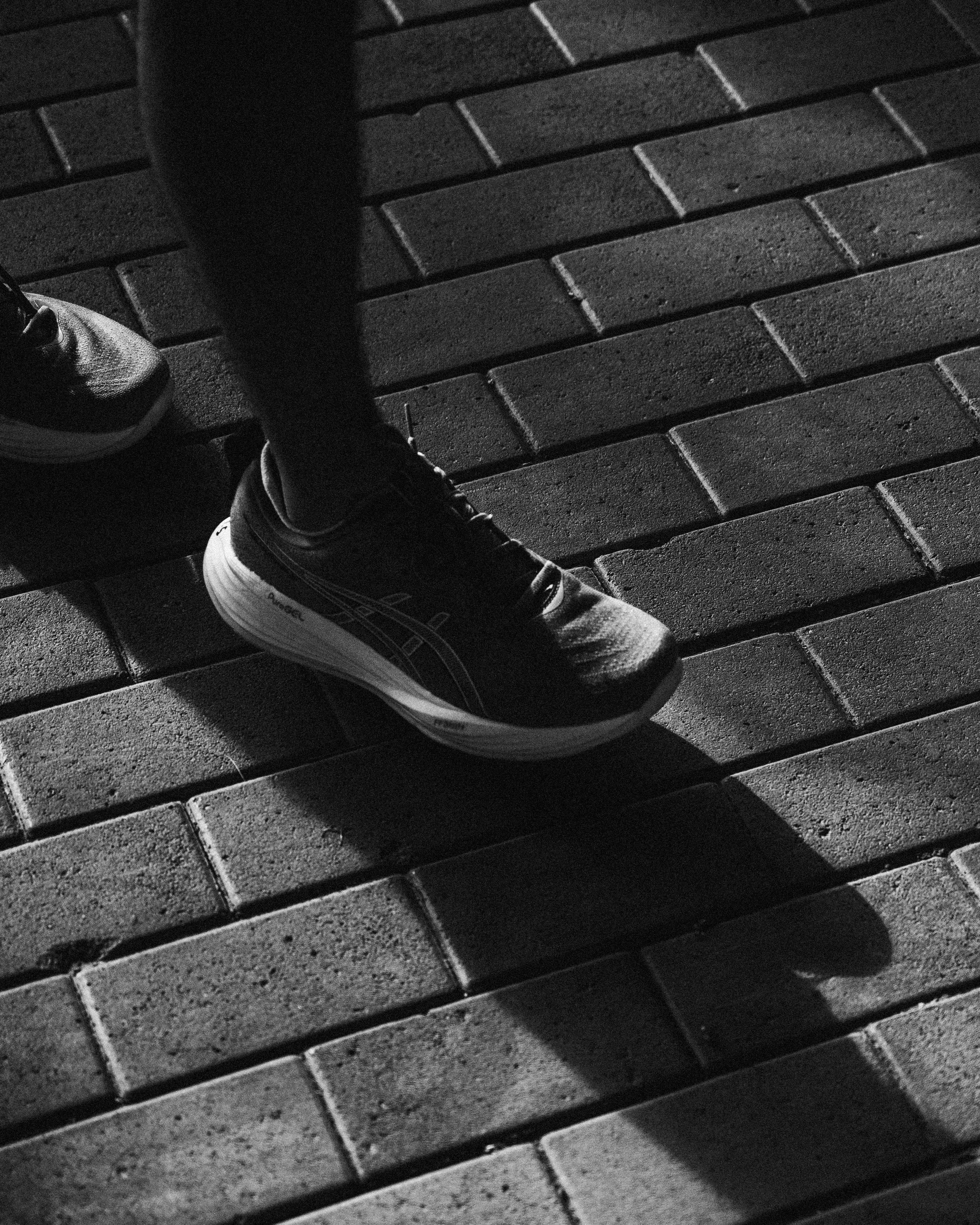 Running shoe detail black and white brand lifestyle photography
