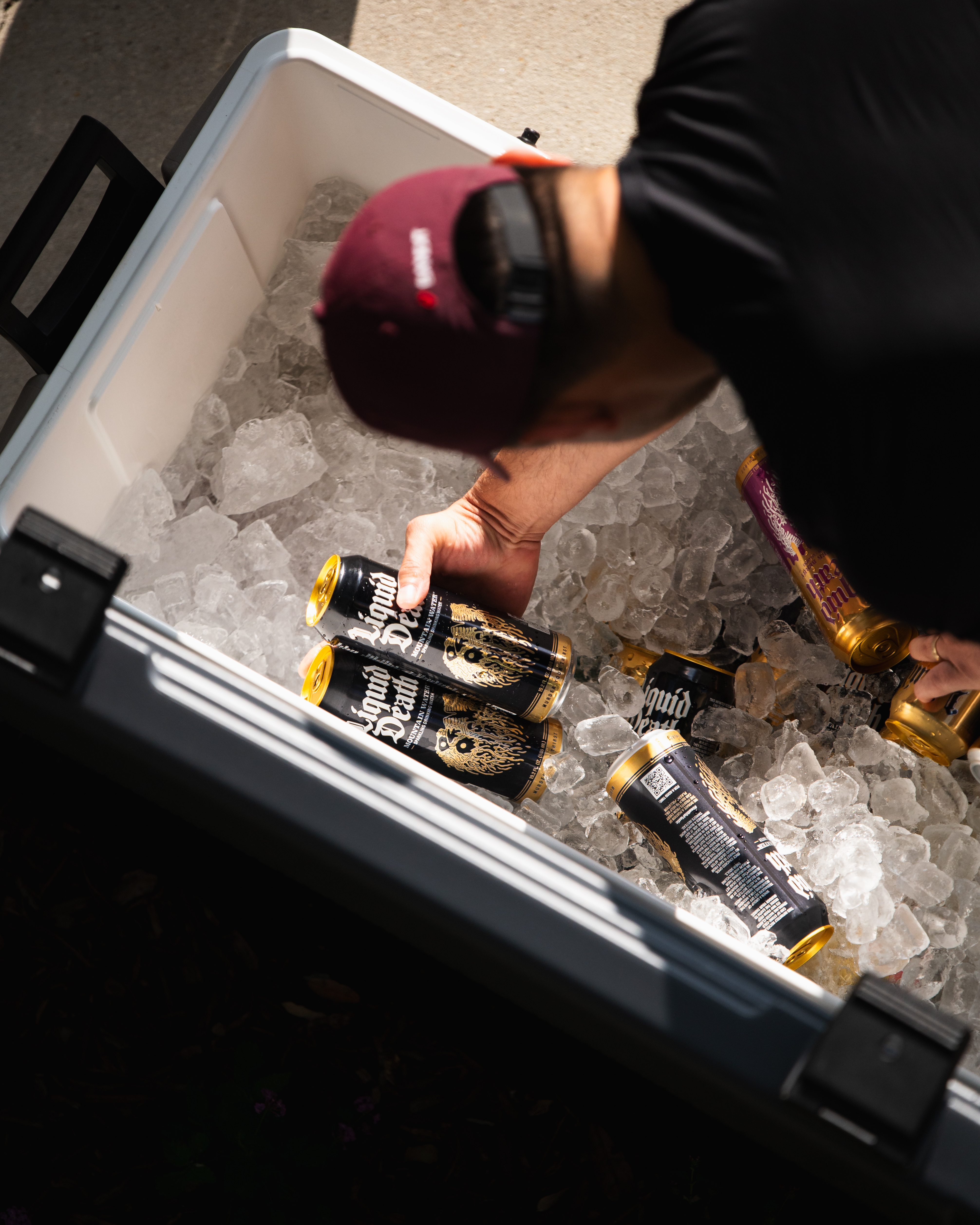 Liquid Death cooler brand lifestyle product photography running event