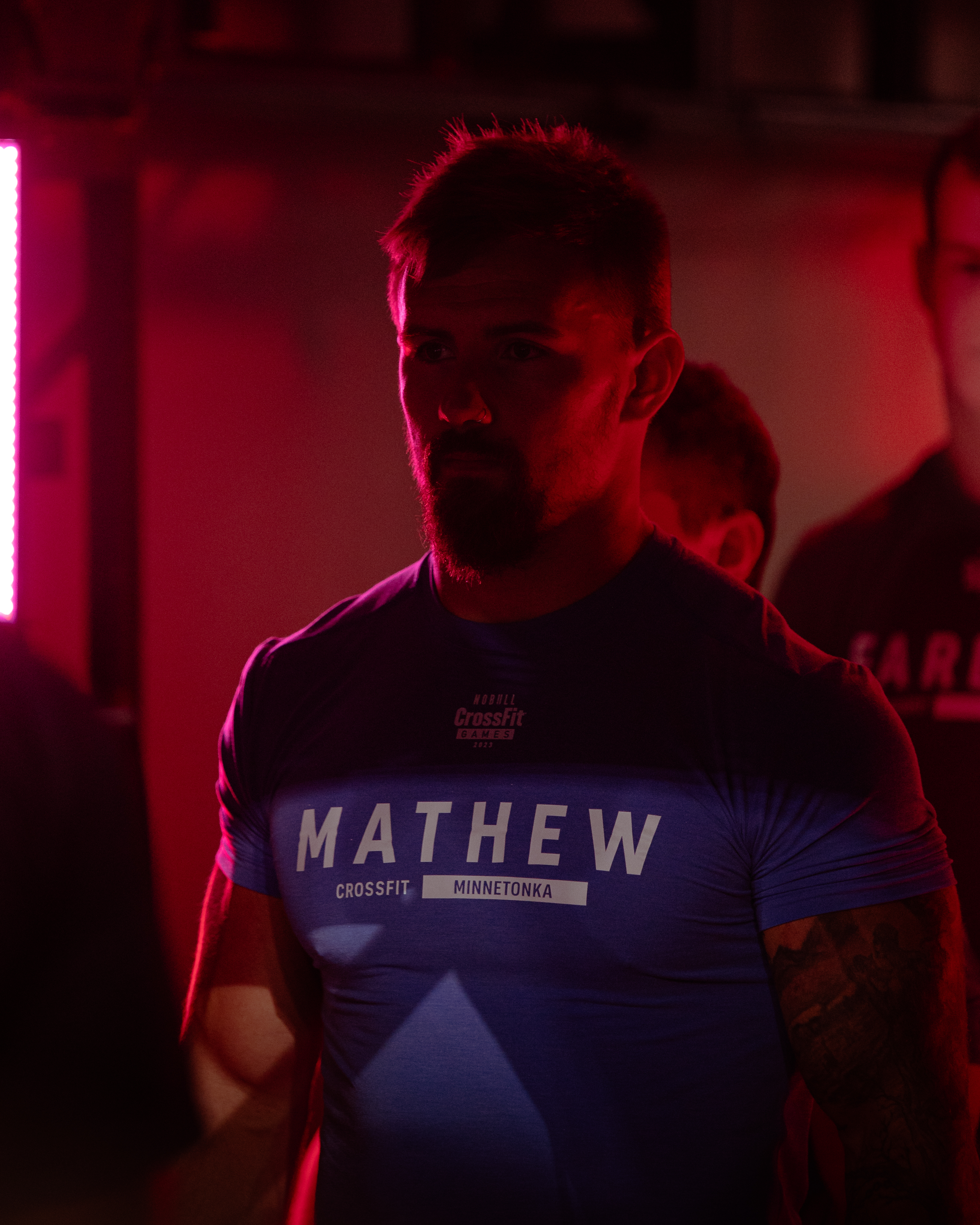 CrossFit Games athlete portrait red neon dramatic light photography
