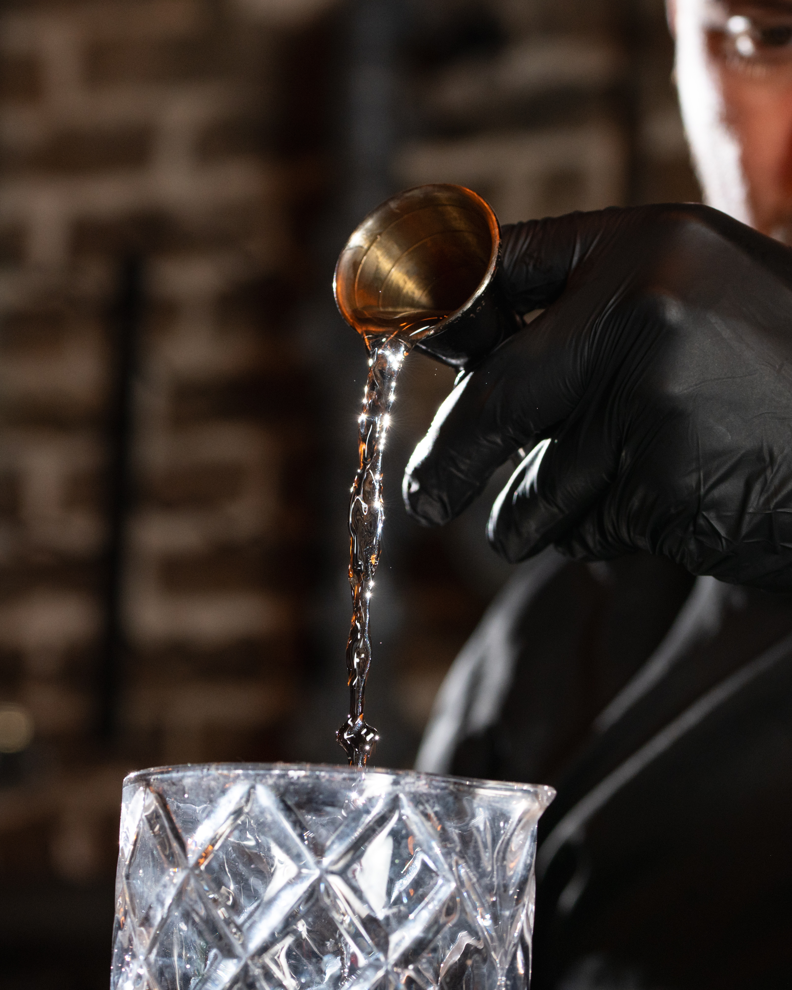 Bartender in black gloves craft cocktail The Cellar San Antonio Texas